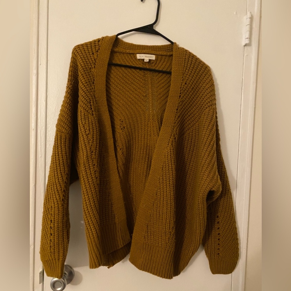 This light brown/tan cardigan sweater is from LA Hearts and is one size only